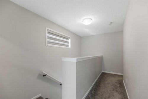 281 Creekside Boulevard Sw, Calgary, AB - Indoor Photo Showing Other Room