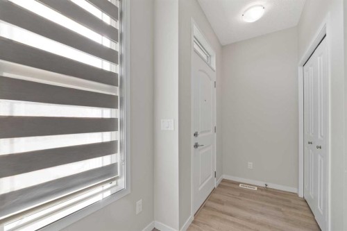 281 Creekside Boulevard Sw, Calgary, AB - Indoor Photo Showing Other Room