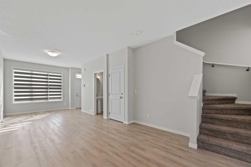 281 Creekside Boulevard Sw, Calgary, AB - Indoor Photo Showing Other Room