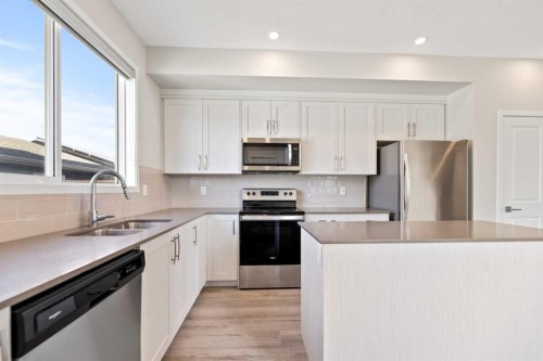 281 Creekside Boulevard Sw, Calgary, AB - Indoor Photo Showing Kitchen With Double Sink