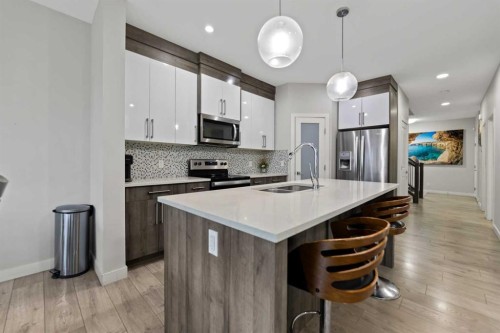 439 Bayview Way Sw, Airdrie, AB - Indoor Photo Showing Kitchen With Double Sink With Upgraded Kitchen
