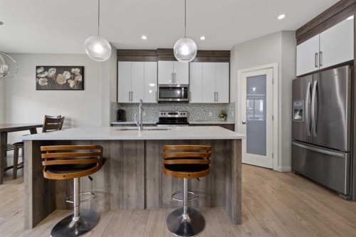 439 Bayview Way Sw, Airdrie, AB - Indoor Photo Showing Kitchen With Upgraded Kitchen