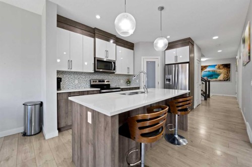 439 Bayview Way Sw, Airdrie, AB - Indoor Photo Showing Kitchen With Double Sink With Upgraded Kitchen