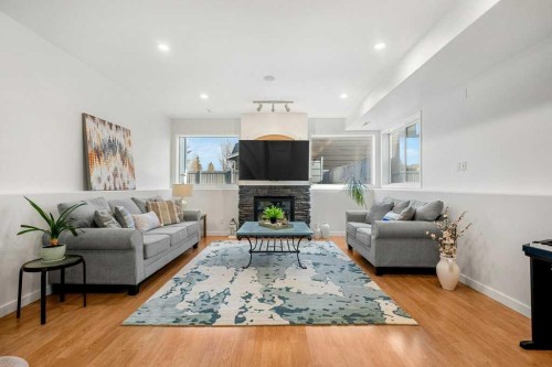 195 Somerglen Common Sw, Calgary, AB - Indoor Photo Showing Living Room With Fireplace