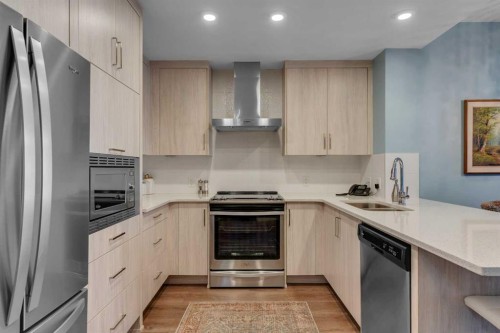 212-12 Mahogany Path Se, Calgary, AB - Indoor Photo Showing Kitchen With Stainless Steel Kitchen With Double Sink With Upgraded Kitchen