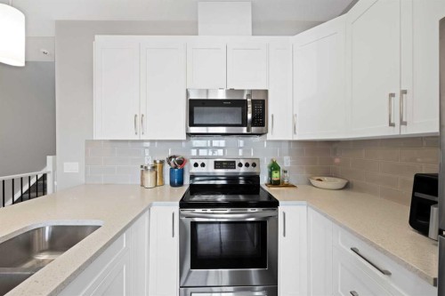 1167 Channelside Drive Sw, Airdrie, AB - Indoor Photo Showing Kitchen