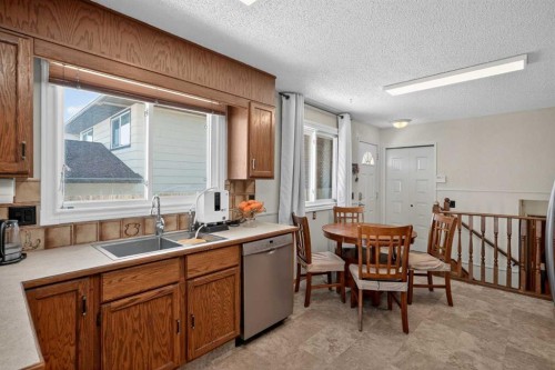 116 Templemont Circle Ne, Calgary, AB - Indoor Photo Showing Kitchen With Double Sink