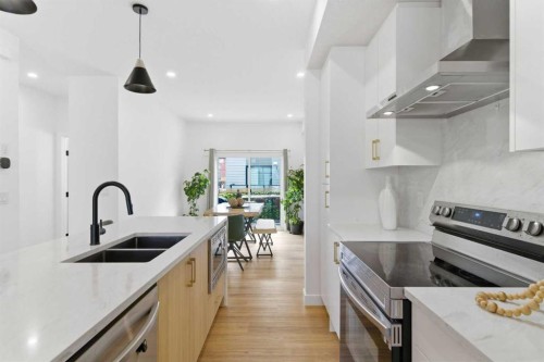 35-903 Mahogany Boulevard Se, Calgary, AB - Indoor Photo Showing Kitchen With Stainless Steel Kitchen With Double Sink With Upgraded Kitchen