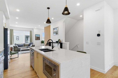 35-903 Mahogany Boulevard Se, Calgary, AB - Indoor Photo Showing Kitchen With Double Sink With Upgraded Kitchen