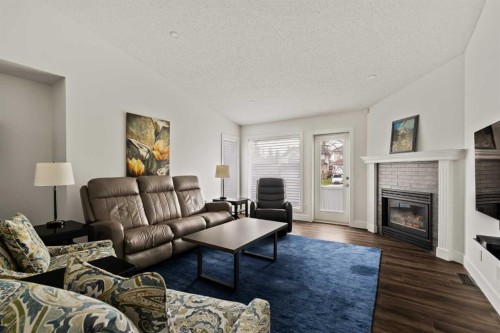 16 Douglasview Park Se, Calgary, AB - Indoor Photo Showing Living Room With Fireplace