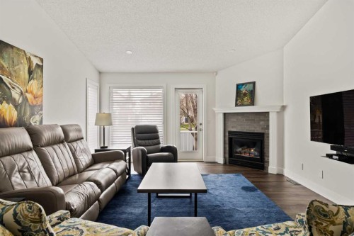 16 Douglasview Park Se, Calgary, AB - Indoor Photo Showing Living Room With Fireplace