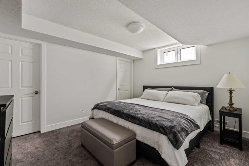 16 Douglasview Park Se, Calgary, AB - Indoor Photo Showing Bedroom