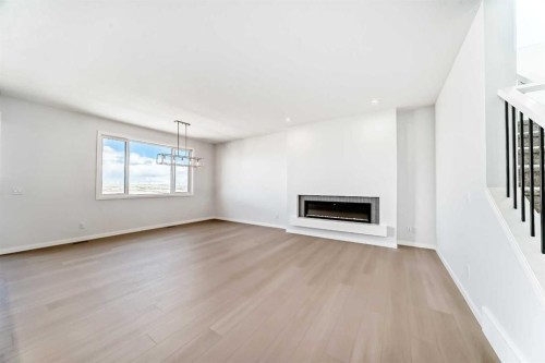 396 Herron Landing Ne, Calgary, AB - Indoor With Fireplace