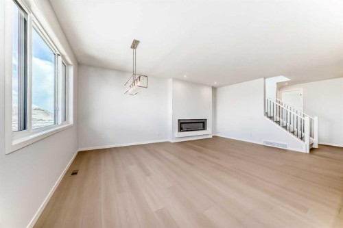 396 Herron Landing Ne, Calgary, AB - Indoor With Fireplace