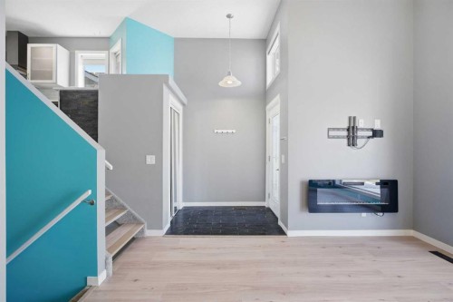 28 Covington Close Ne, Calgary, AB - Indoor Photo Showing Other Room With Fireplace