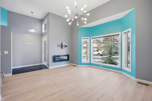 28 Covington Close Ne, Calgary, AB - Indoor Photo Showing Other Room With Fireplace