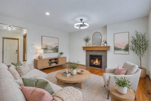 43 Elgin View Se, Calgary, AB - Indoor Photo Showing Living Room With Fireplace