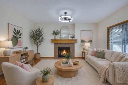 43 Elgin View Se, Calgary, AB - Indoor Photo Showing Living Room With Fireplace