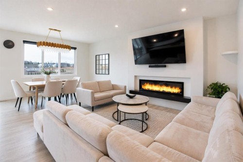 206 Rowley Way Nw, Calgary, AB - Indoor Photo Showing Living Room With Fireplace