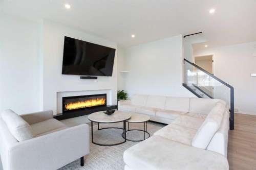 206 Rowley Way Nw, Calgary, AB - Indoor Photo Showing Living Room With Fireplace