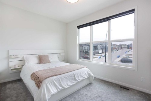 206 Rowley Way Nw, Calgary, AB - Indoor Photo Showing Bedroom