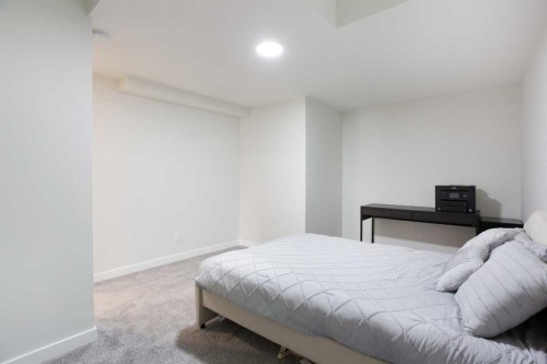 206 Rowley Way Nw, Calgary, AB - Indoor Photo Showing Bedroom