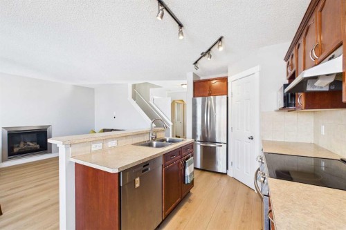 216 Covepark Green Ne, Calgary, AB - Indoor Photo Showing Kitchen With Double Sink