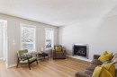 216 Covepark Green Ne, Calgary, AB  - Indoor Photo Showing Living Room With Fireplace 