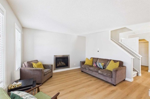 216 Covepark Green Ne, Calgary, AB - Indoor Photo Showing Living Room With Fireplace