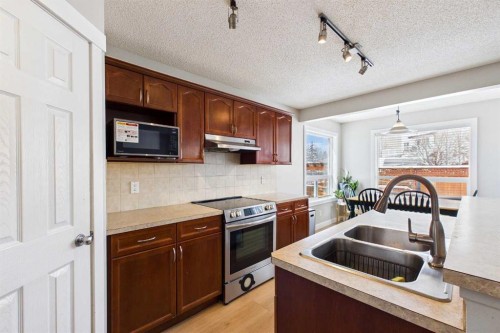 216 Covepark Green Ne, Calgary, AB - Indoor Photo Showing Kitchen With Double Sink