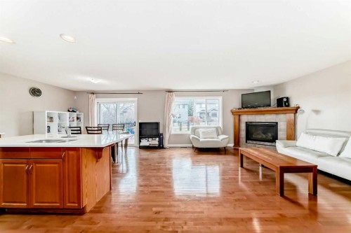 264 Everwillow Green Sw, Calgary, AB - Indoor Photo Showing Living Room With Fireplace