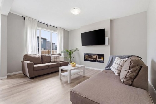 22 Carrington Crescent Nw, Calgary, AB - Indoor Photo Showing Living Room With Fireplace
