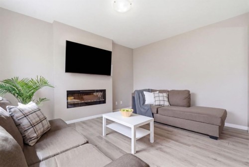 22 Carrington Crescent Nw, Calgary, AB - Indoor Photo Showing Living Room With Fireplace