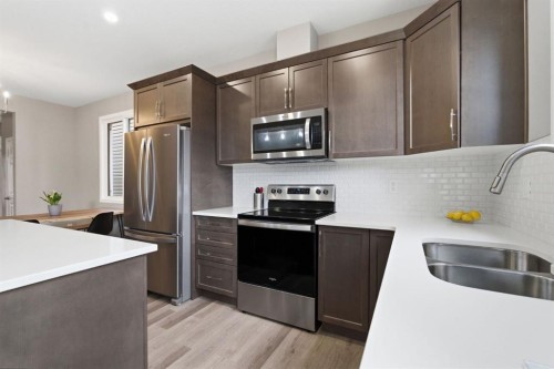 22 Carrington Crescent Nw, Calgary, AB - Indoor Photo Showing Kitchen With Stainless Steel Kitchen With Double Sink