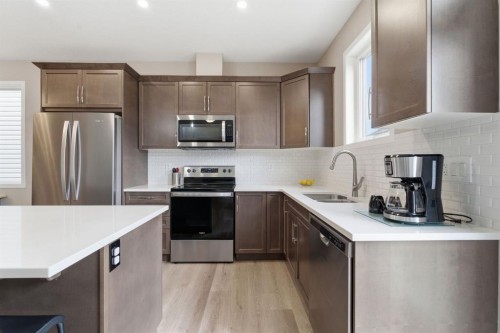 22 Carrington Crescent Nw, Calgary, AB - Indoor Photo Showing Kitchen With Stainless Steel Kitchen With Double Sink With Upgraded Kitchen