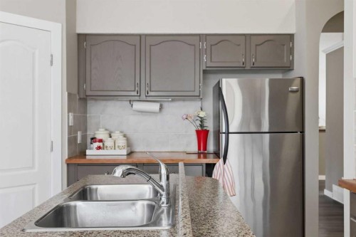 7 Chaparral Road Se, Calgary, AB - Indoor Photo Showing Kitchen With Double Sink