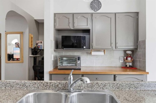 7 Chaparral Road Se, Calgary, AB - Indoor Photo Showing Kitchen With Double Sink