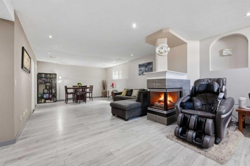 7 Chaparral Road Se, Calgary, AB - Indoor Photo Showing Living Room With Fireplace