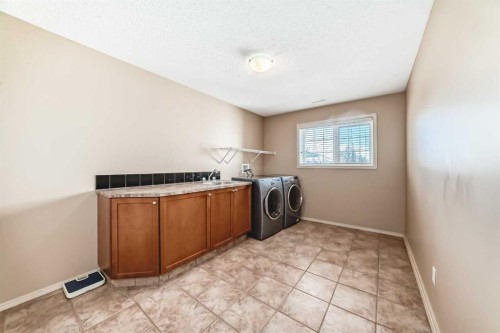 92 Hamptons Drive Nw, Calgary, AB - Indoor Photo Showing Laundry Room