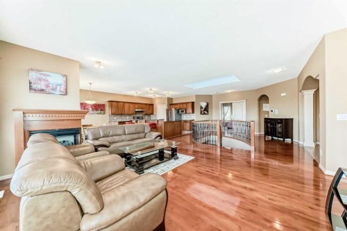 92 Hamptons Drive Nw, Calgary, AB - Indoor Photo Showing Living Room With Fireplace