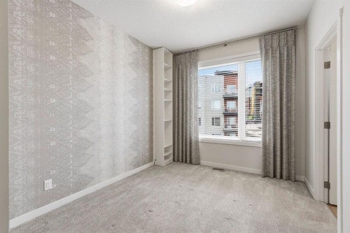84 Shawnee Common Sw, Calgary, AB - Indoor Photo Showing Other Room