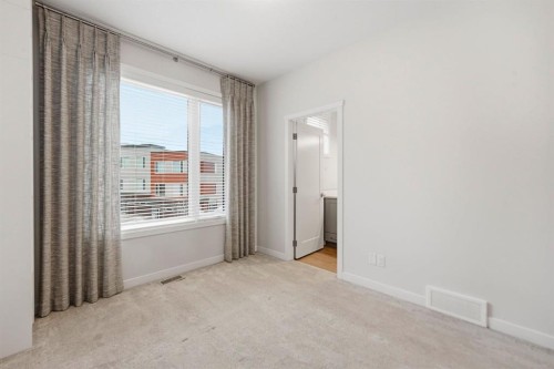 84 Shawnee Common Sw, Calgary, AB - Indoor Photo Showing Other Room