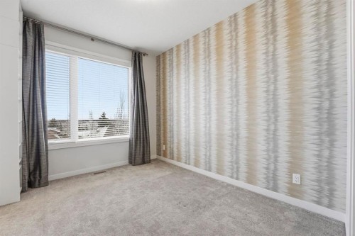 84 Shawnee Common Sw, Calgary, AB - Indoor Photo Showing Other Room