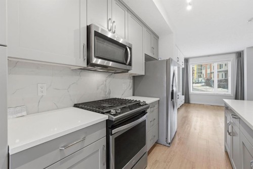 84 Shawnee Common Sw, Calgary, AB - Indoor Photo Showing Kitchen With Upgraded Kitchen