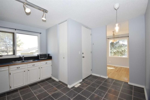 2604 106 Avenue Sw, Calgary, AB - Indoor Photo Showing Kitchen With Double Sink