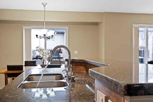 10 Bridlerange Circle Sw, Calgary, AB - Indoor Photo Showing Kitchen With Double Sink