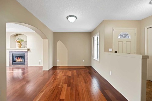 10 Bridlerange Circle Sw, Calgary, AB - Indoor Photo Showing Other Room With Fireplace