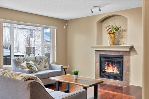 10 Bridlerange Circle Sw, Calgary, AB - Indoor Photo Showing Living Room With Fireplace