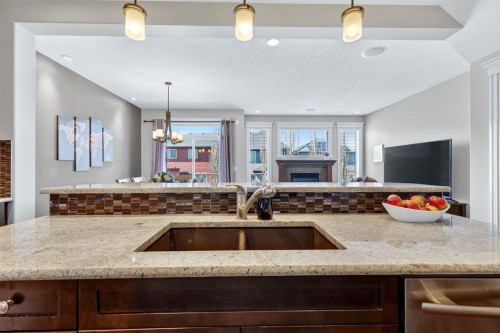 202 Evansridge Circle Nw, Calgary, AB - Indoor Photo Showing Kitchen With Fireplace