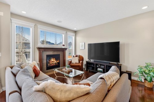 202 Evansridge Circle Nw, Calgary, AB - Indoor Photo Showing Living Room With Fireplace